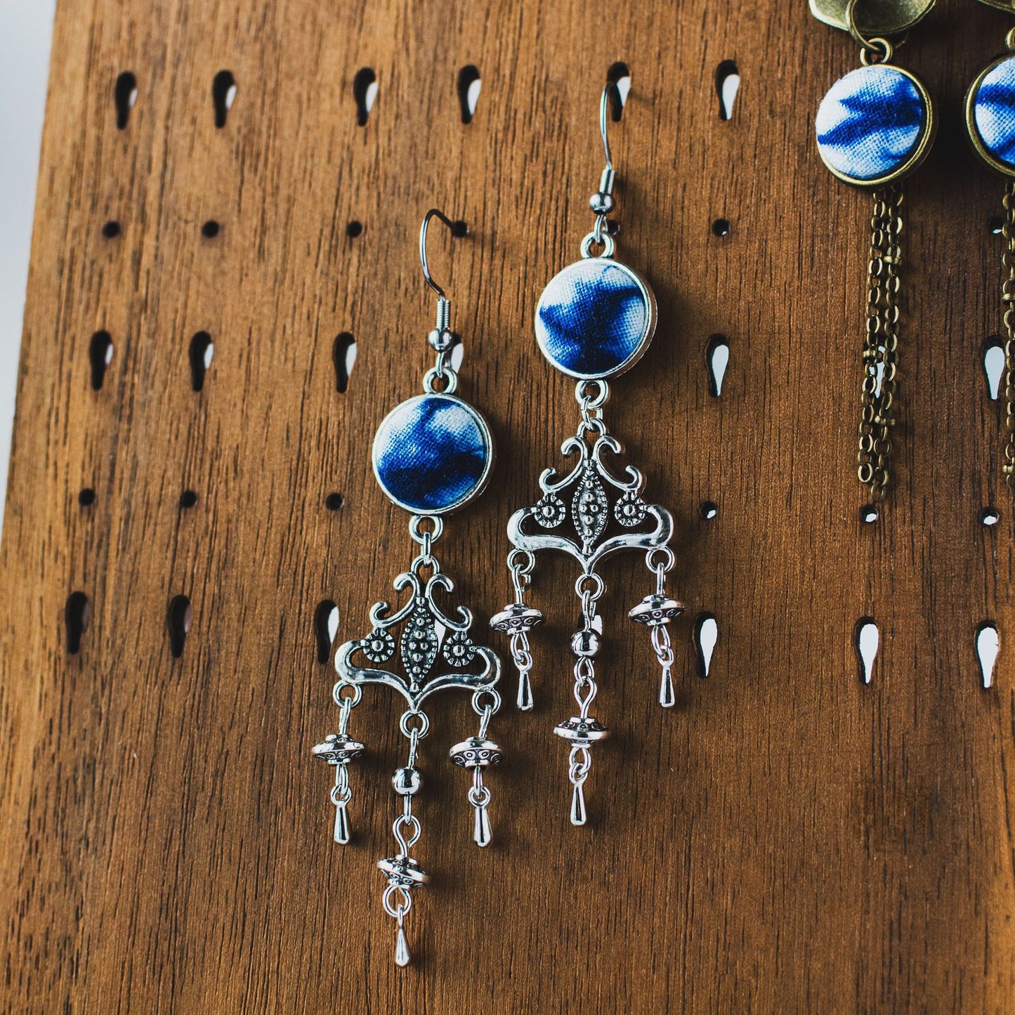 Handcrafted tie-dyed silver earrings in the style of a European castle