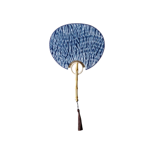 Handmade tie-dye fan with natural bamboo handle and ice-crack pattern on the surface
